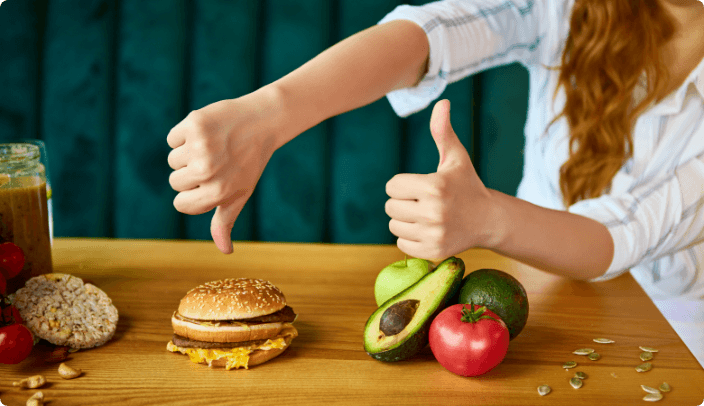 Woman showing thumbs down to burger