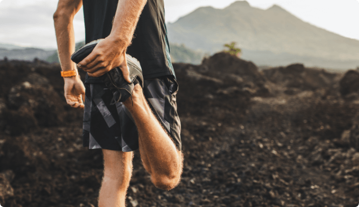 Man lifting leg up to bottom